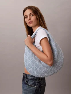 Denim crescent tas met all-over embleemlogo