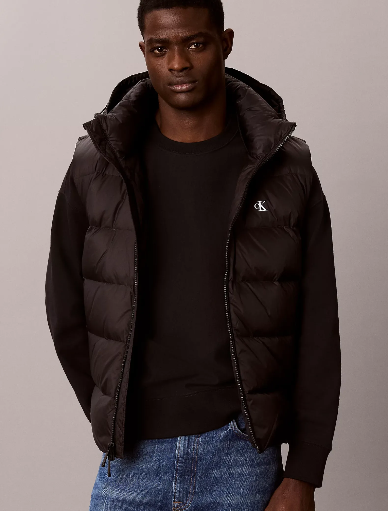 Donzen puffer bodywarmer met capuchon