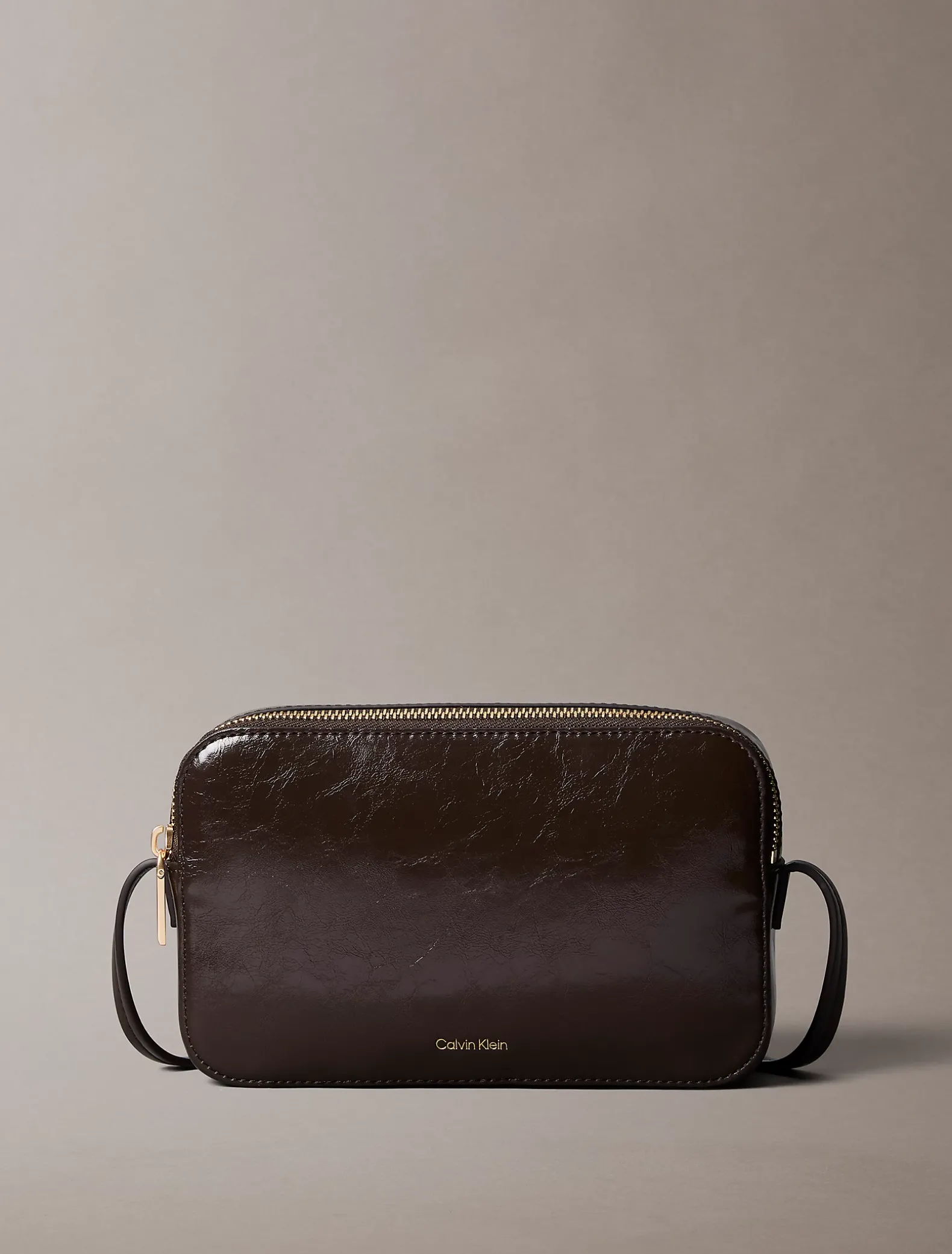 Glanzende crossbody fototas met folielogo