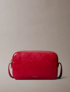 Glanzende crossbody fototas met folielogo
