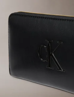 Lange portemonnee met rits en monogram in reliëf