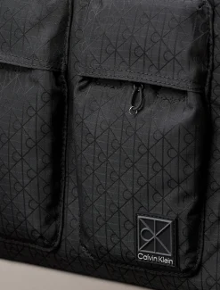 Laptophoes allo-over embleem jacquard met logo
