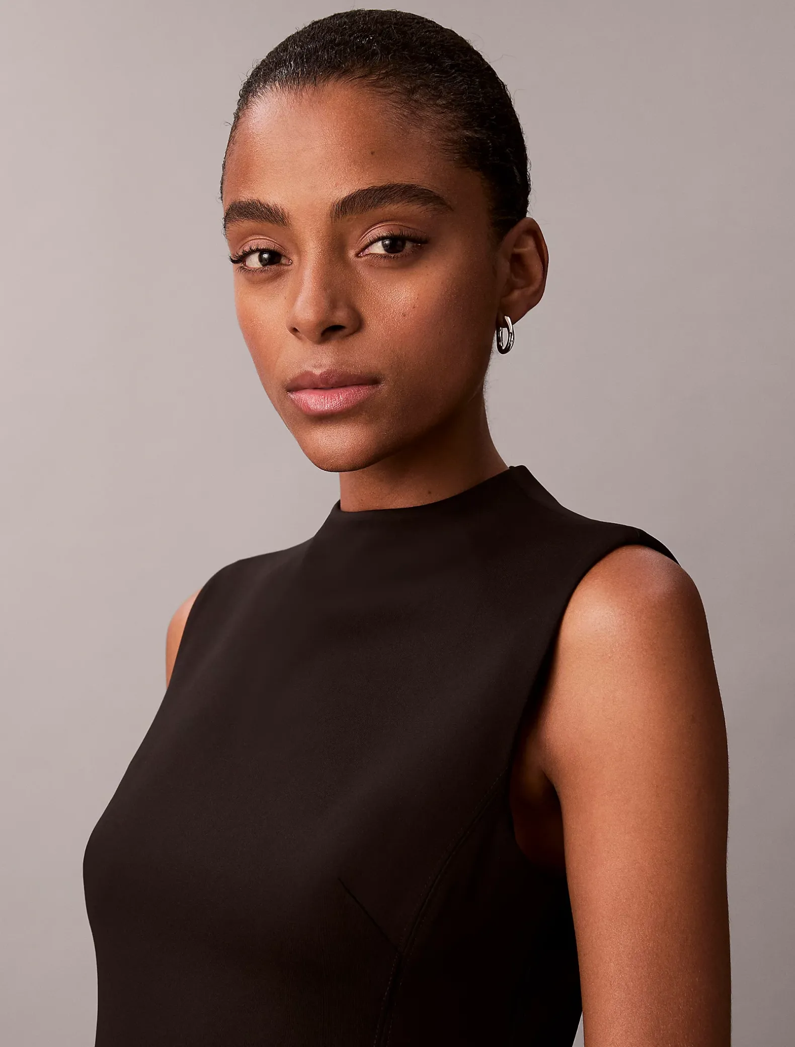 Mouwloze stretch fit en flare jurk