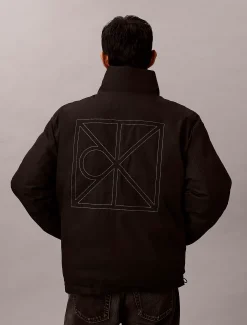 Omkeerbaar pufferjack met all-over embleem logo