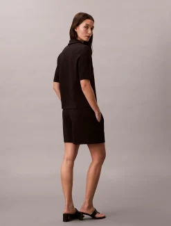 Polotop met rits en korte mouwen