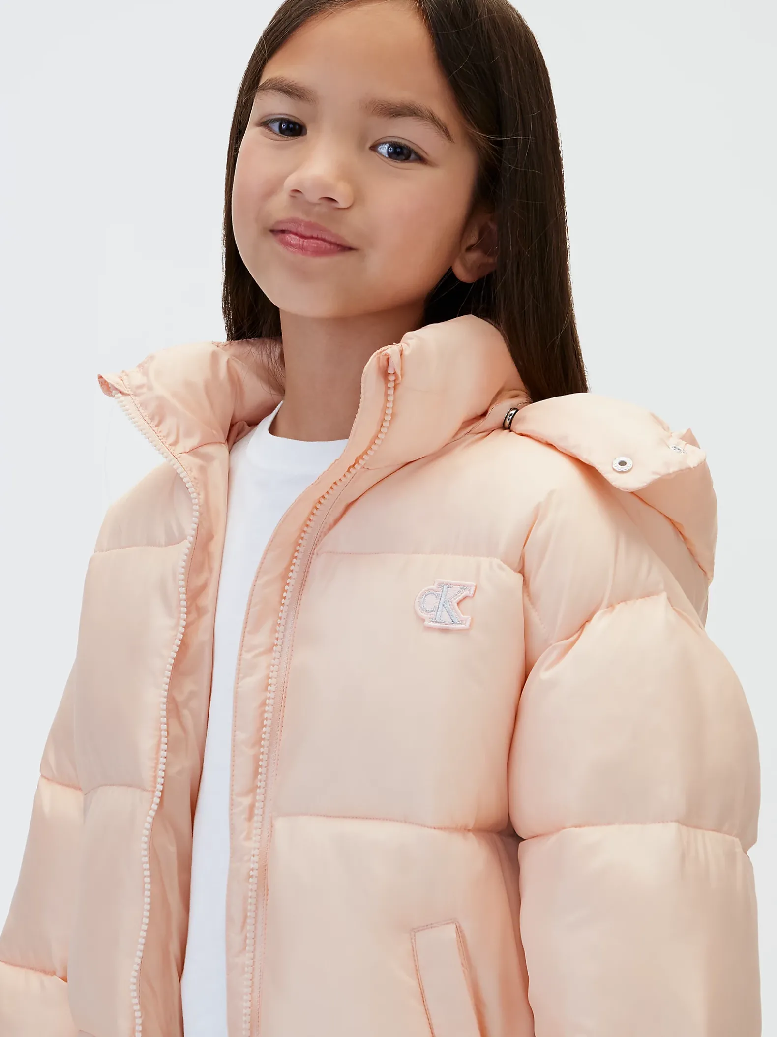 Pufferjas met capuchon en logo voor kinderen