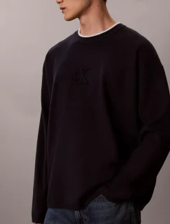 Relaxed sweater met monogram-logo in reliëf