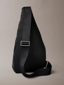 Sling bag met verzonken all-over embleemlogo