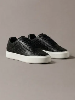 Sneakers met logo embleem in reliëf