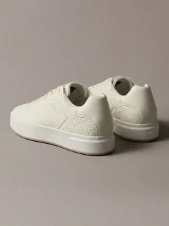 Sneakers met logo embleem in reliëf