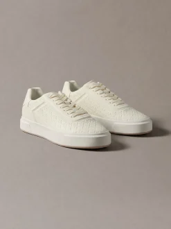 Sneakers met logo embleem in reliëf