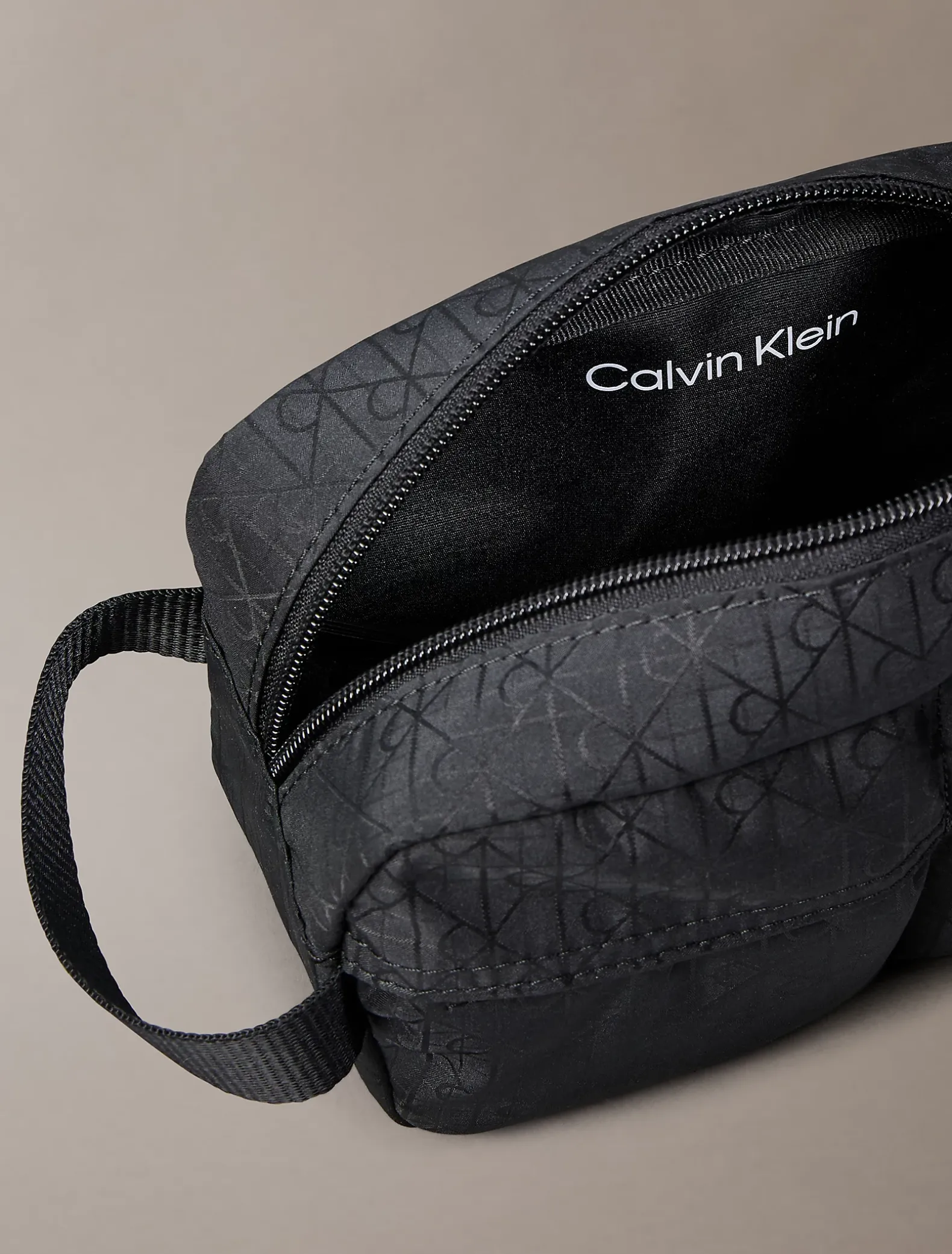 Toilettas jacquard met logo en all-over embleem